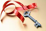 old key with a red ribbon