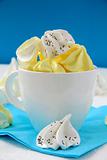 colorful meringue  beze cookies in a cup