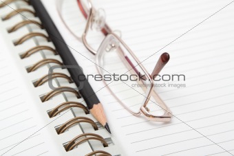 A diary and reading glasses
