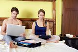 young couple working from home with pc