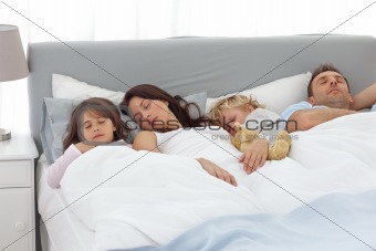 Relaxed family doing a nap together