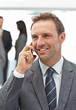 Successful businessman on the phone during a meeting