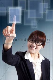 Smiling business woman pressing a touchscreen button