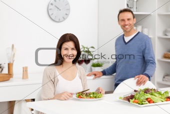 Happy man binging glasses of red wine to his girlfriend