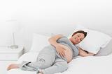 Pregnant woman on her bed 