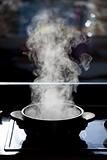 steam rising off a boiling pot 