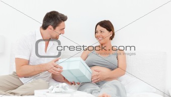 Woman offering a gift to her wife
