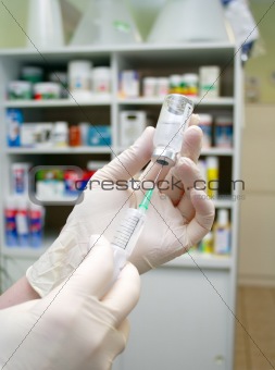 syringe that is being filled with vaccine