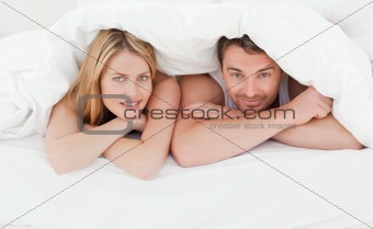 Lovely couple in their bed