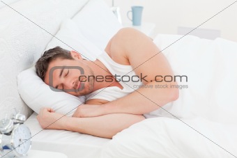 A man in his bed before waking up