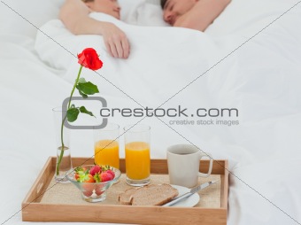 Lovers sleeping after having breakfast