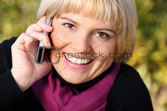 Beautiful young woman talking on the phone