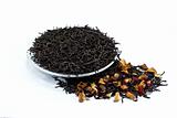 black tea leaves with dried fruit tea on white background