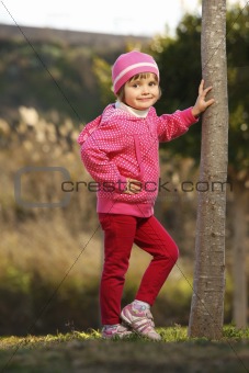 Young cute girl posing in the park