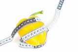 tape measure and yellow pepper isolated on white