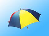 bright umbrella over blue background