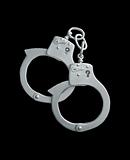metal handcuffs isolated on black background 