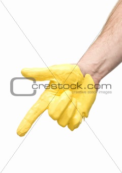 Yellow painted hand pointing