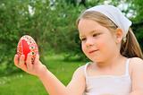Little girl holding Easter egg