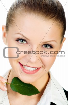 young girl with a small, green leaf. isolated
