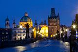 czech republic prague - charles bridge and spires of the old town at dusk