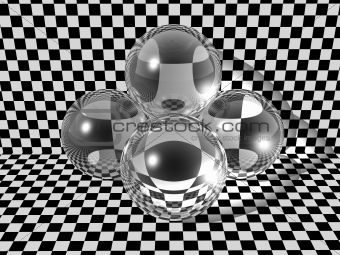 Three glass balls on checkerboard background