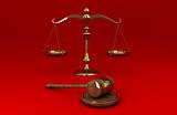 Golden scale and gavel on red solid background