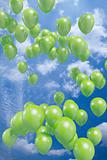 Green balloons flying in the air