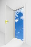 Open door with cloudy blue sky behind it