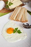 Delicious sunny side egg with roasted toast for breakfast