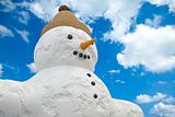Snowman in front of a cloudy sky