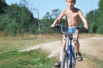 innocent little kid on bicycle 