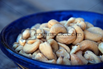 cashew nuts in blue bowl