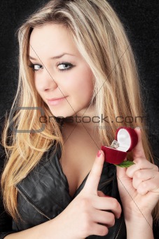  blond holds ring