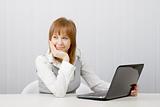 relaxed and smiling girl with laptop