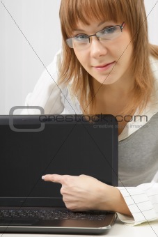 girl in glasses with a laptop