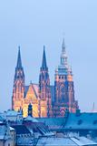 prague in winter - lesser town roofs and hradcany castle at dusk