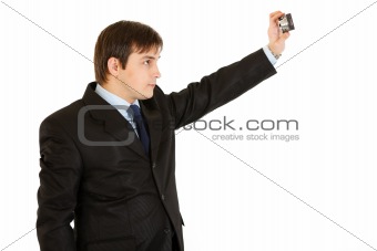  Modern young businessman photographing himself
