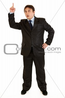 Modern businessman with raised finger. Idea gesture
