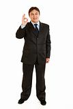 Smiling young businessman showing ok gesture
