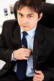 Portrait of successful young businessman at office
