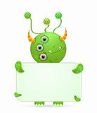 green smiley monster with empty placard