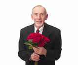 Elderly man holding bouquet of red roses