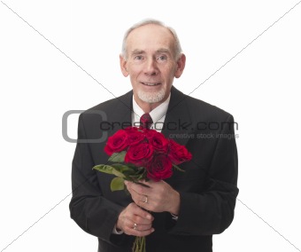 Elderly man holding bouquet of red roses