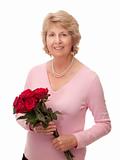 Senior woman holding bunch of red roses