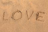 Inscription on sand LOVE