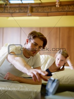 young couple waking up in the morning
