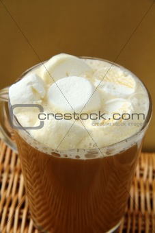 Coffee with marshmallows in large glass beaker