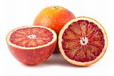 Full and two half of blood red oranges