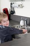 Child washing his hands